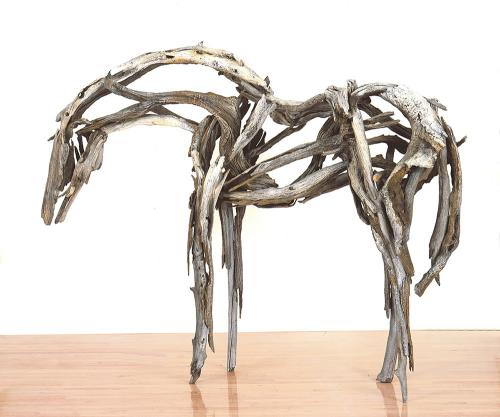 Horse sculpture of bronze made to look like pieces of wood by Deborah Butterfield.