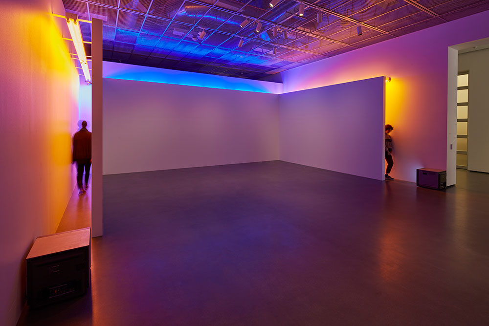 Installation photo of Bruce Nauman's Blue and Yellow Corridor at the Manetti Shrem Museum.