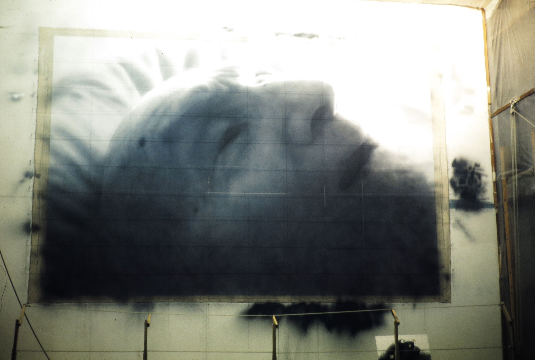 Painting of elderly man laying down in progress.