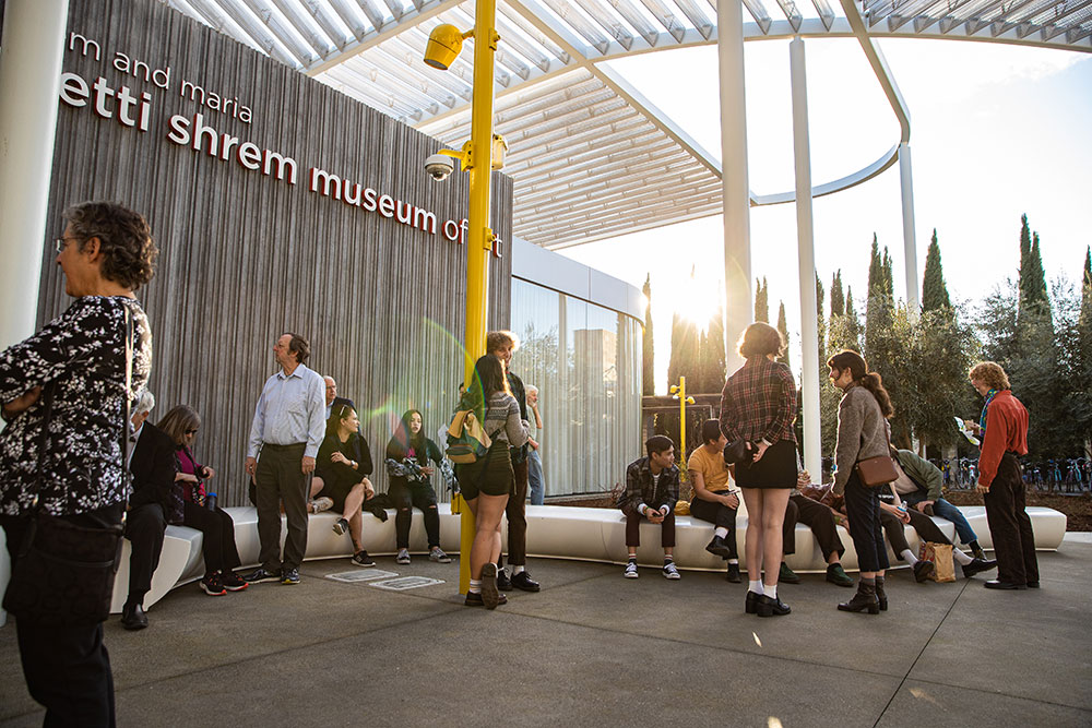 People gathering in a plaza at the museum.