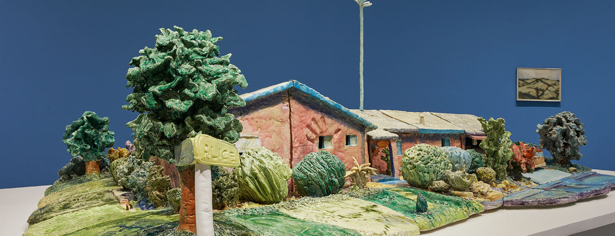 Ceramic sculpture of a house.
