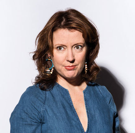 Photograph of museum director Rachel Teagle wearing a blue shirt,