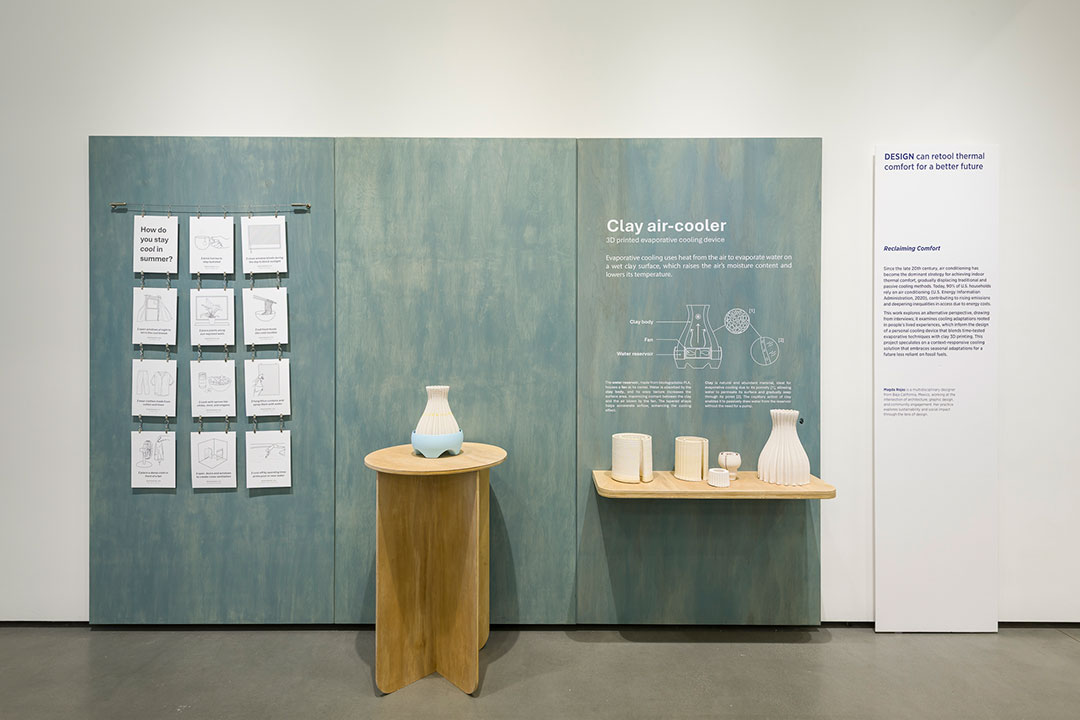 Display of various 3D printed vessels with printed information about them on the wall.