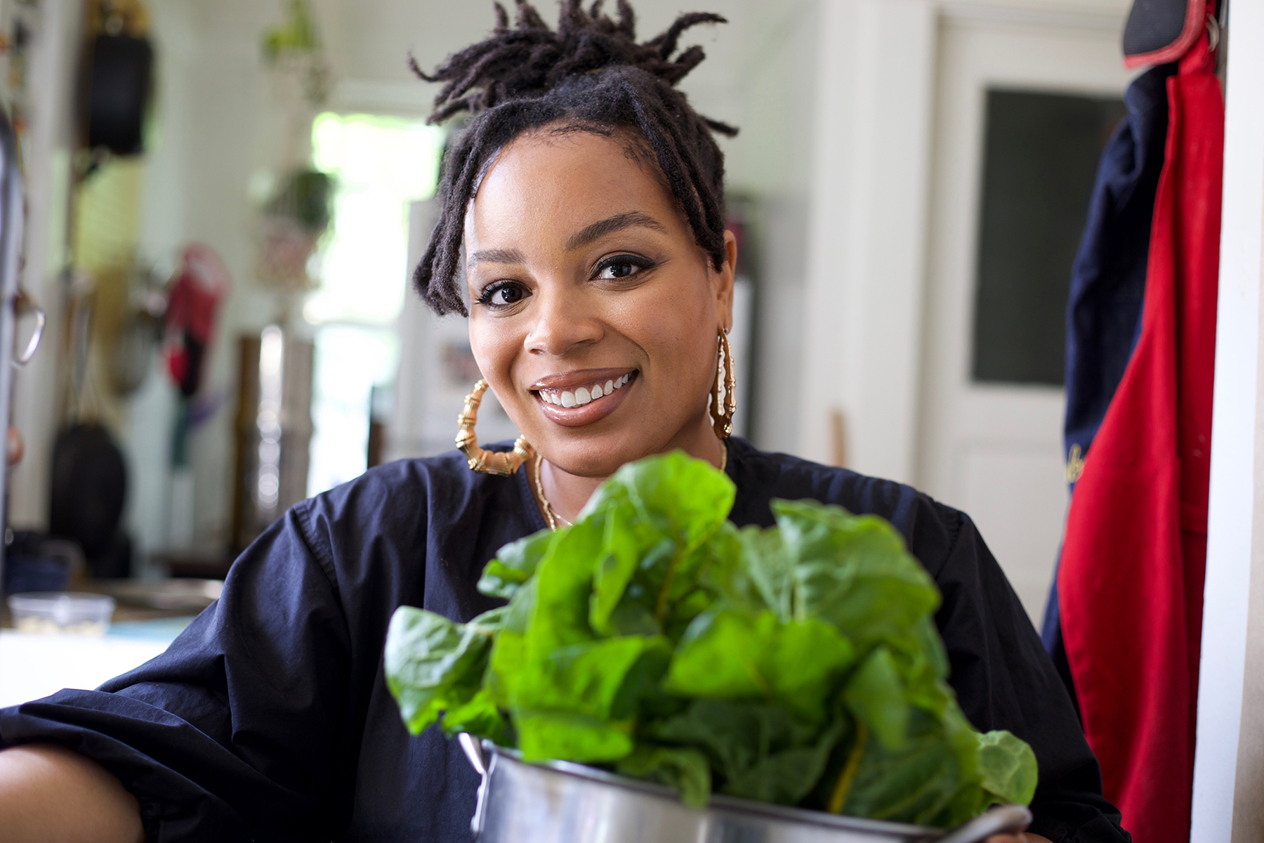 Artist Nia Lee with lettuce.