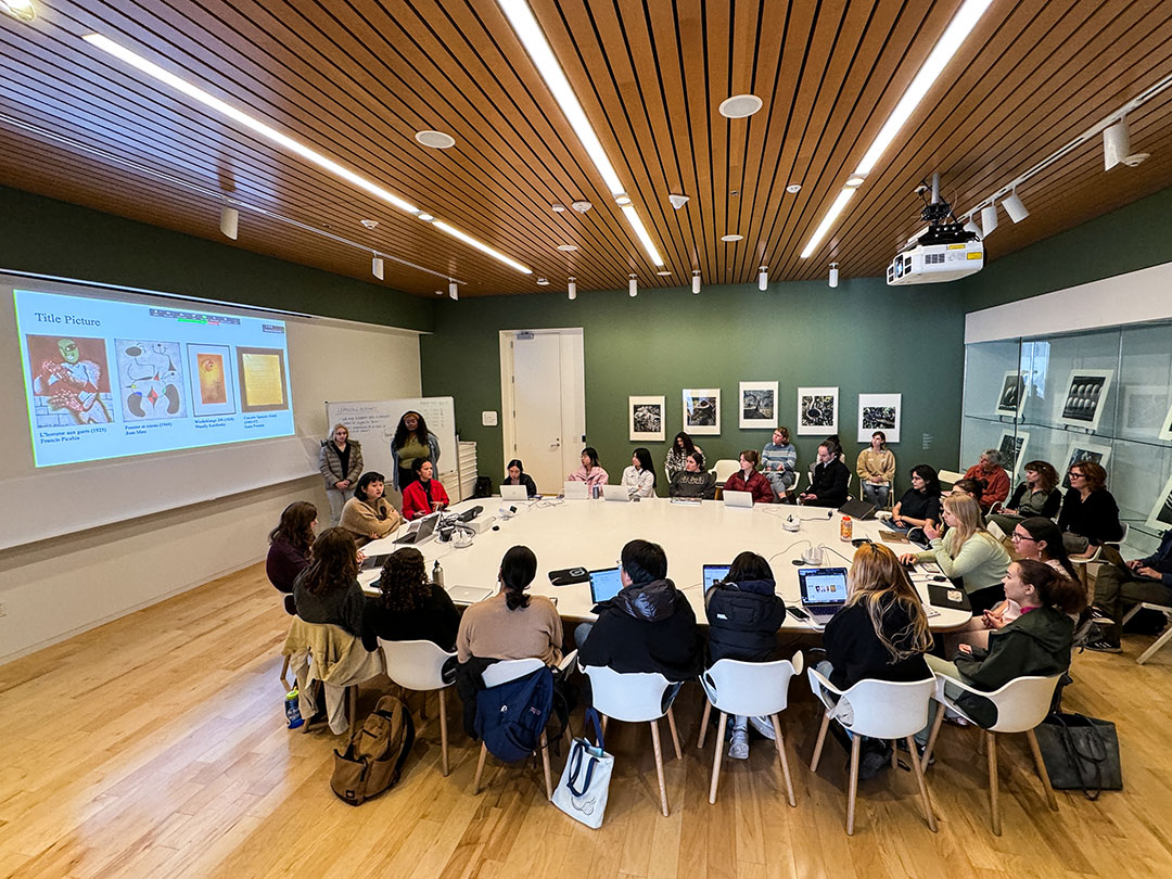 Students listening to a lecture in the Collections Classroom.