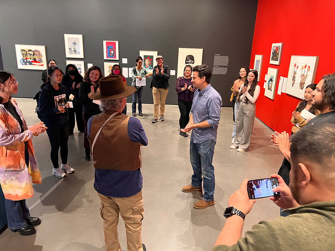 Students in the gallery listening to a talk.