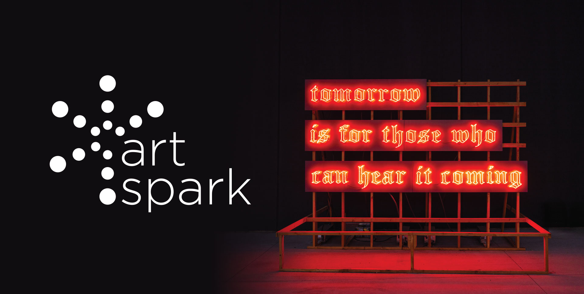Red neon sign that says 'Tomorrow is for those who can hear it coming' and the logo for Art Spark in white.