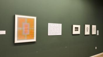 Artwork on a green wall in the museum.