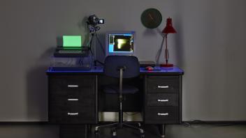 Office of hacked objects under blacklight at the Manetti Shrem Museum. Image: Manetti Shrem Museum and Cleber Bonato.