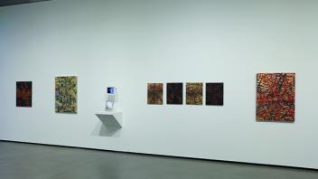 Installation shot of Lipid Matrix Paintings & prima materia art book