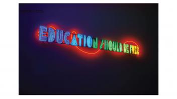 Neon artwork in the lobby saying 'Education Should be Free'.