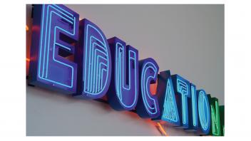 Detail of the neon artwork in the lobby, 'Education Should be Free'.