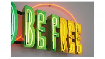 Detail of the neon artwork in the lobby, 'Education Should be Free'.