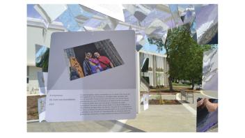 Installation shot of work by Edward Whelan with cards hanging.