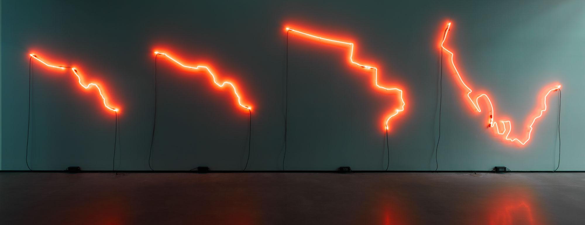Red neon abstract lines installed in the gallery.