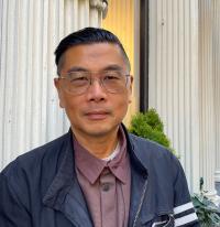 Headshot of artist Byron Kim.