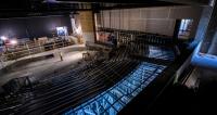 Interior of an auditorium under construction.