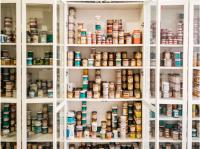 Cabinet of glazes in Kathy Butterly's studio.