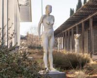 White statue of a woman by Manuel Neri outside the museum.
