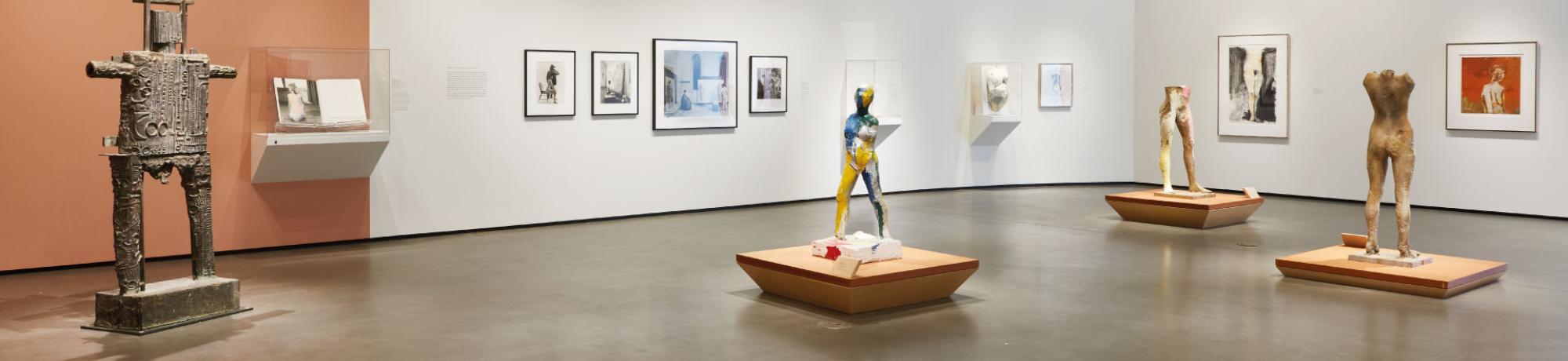 Gallery with sculptures and art displayed.
