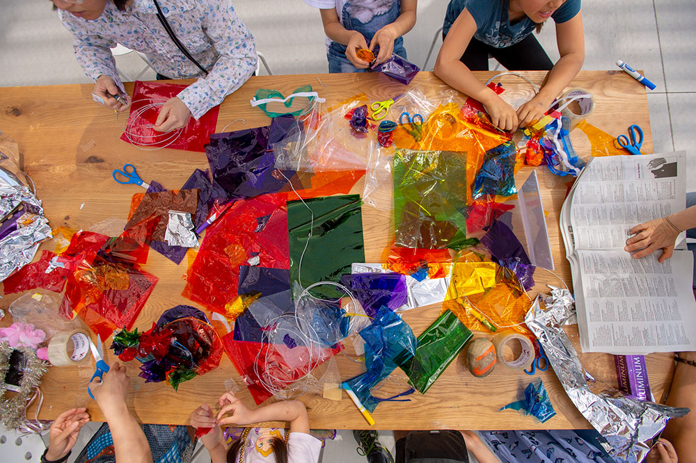 Photo of people making art.