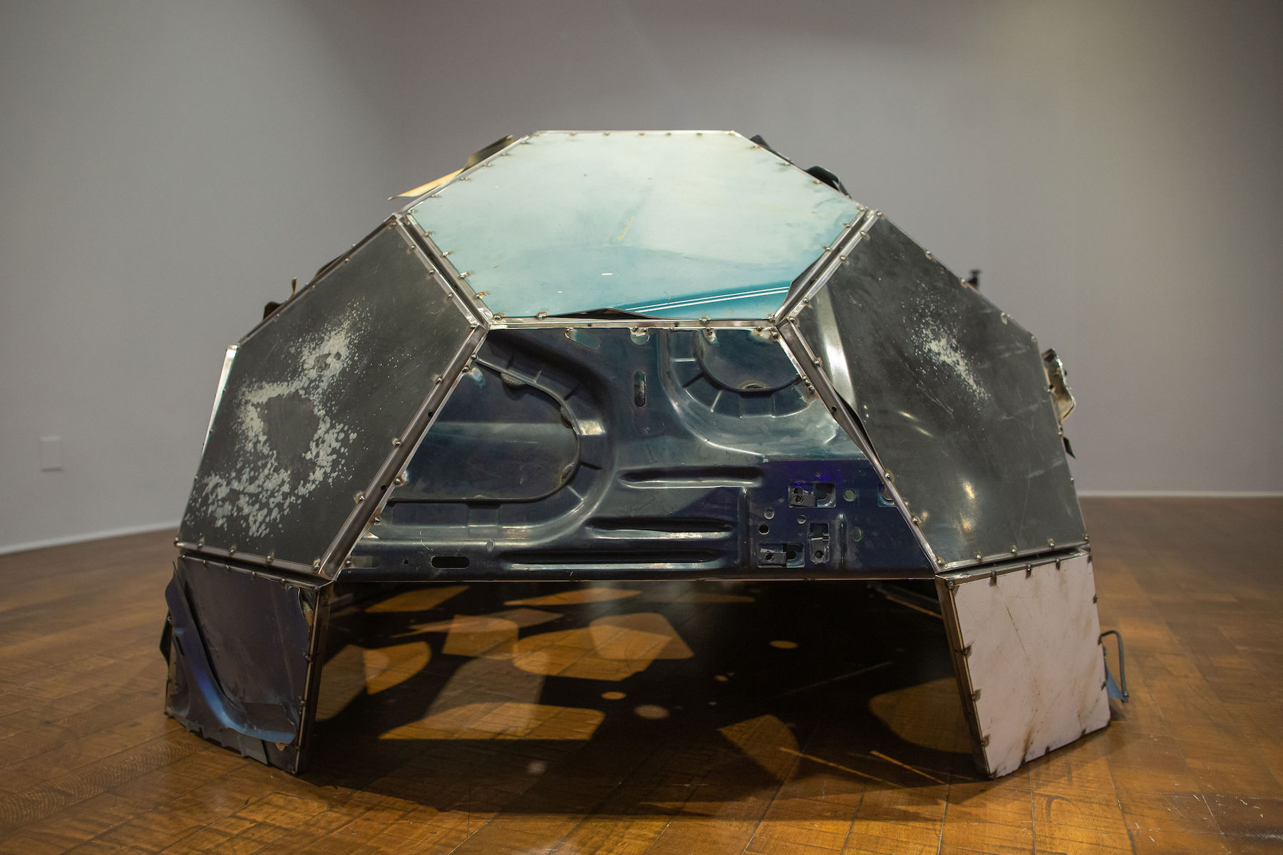 Photo of artwork by Beatriz Cortez with glass and metal in a dome shape.