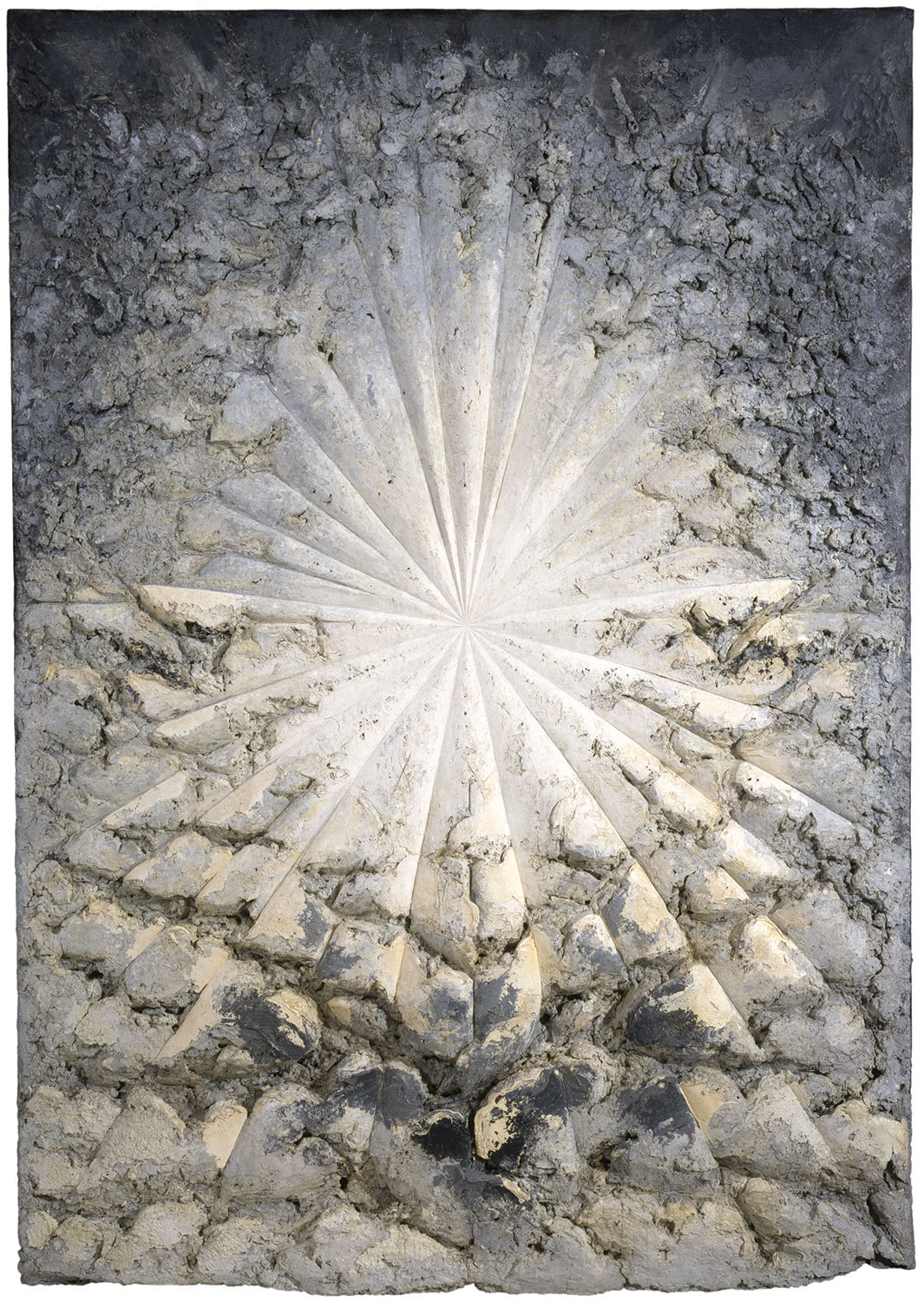 Artwork that looks like a burst of light on a rocky background.