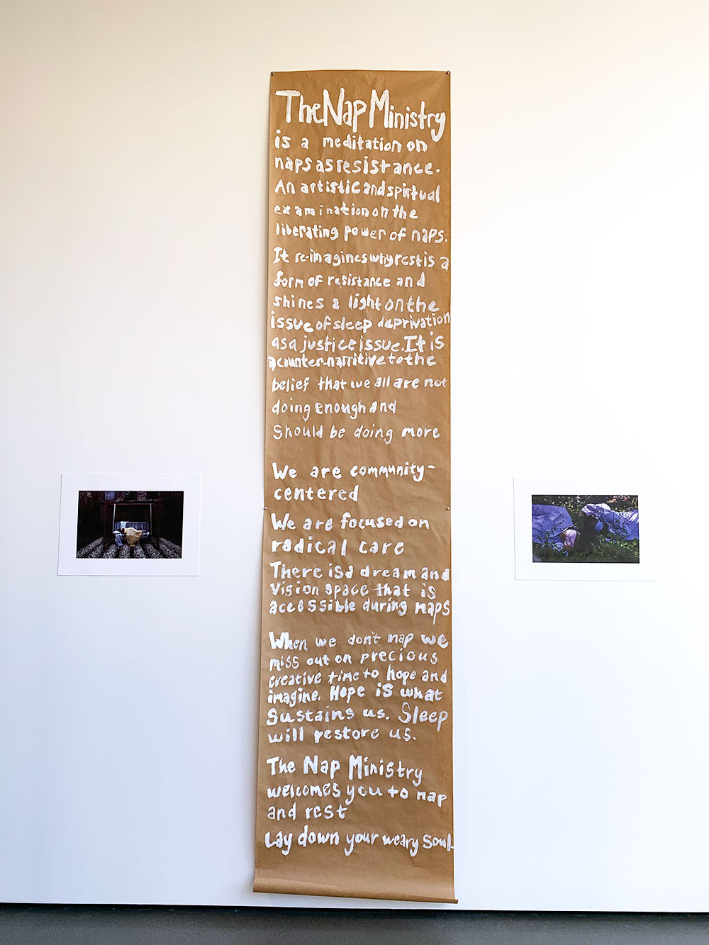 White text on brown paper with the following words: The Nap Ministry is a meditation on naps as resistance. An artistic and spiritual examination on the liberating power of naps. It reimagines why rest is a form of resistance and shines a light on the issue of sleep deprivation as a justice issue. It is a counter-narrative to the belief that we all are not doing enough and should be doing more. We are community centered. We are focused on radical care. There is a dream and vision space that is accessible during naps. When we don’t nap we miss out on precious creative time to hope and imagine. Hope is what sustains us. Sleep will restore us. The Nap Ministry welcomes you to nap and rest. Lay down your weary soul.