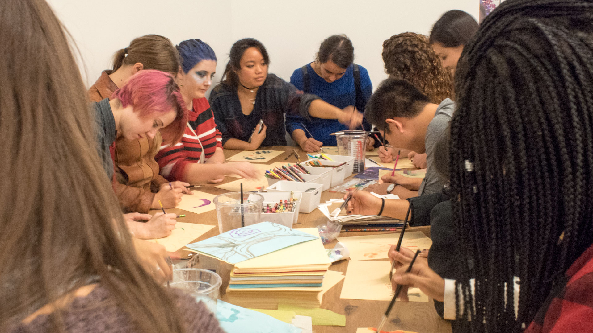 Students making art in the art studio.