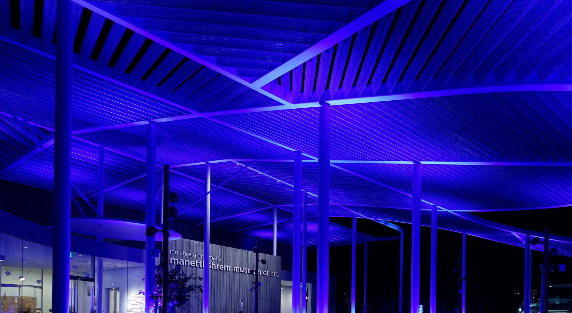 Photo of the Manetti Shrem Museum Event Plaza lit at night.