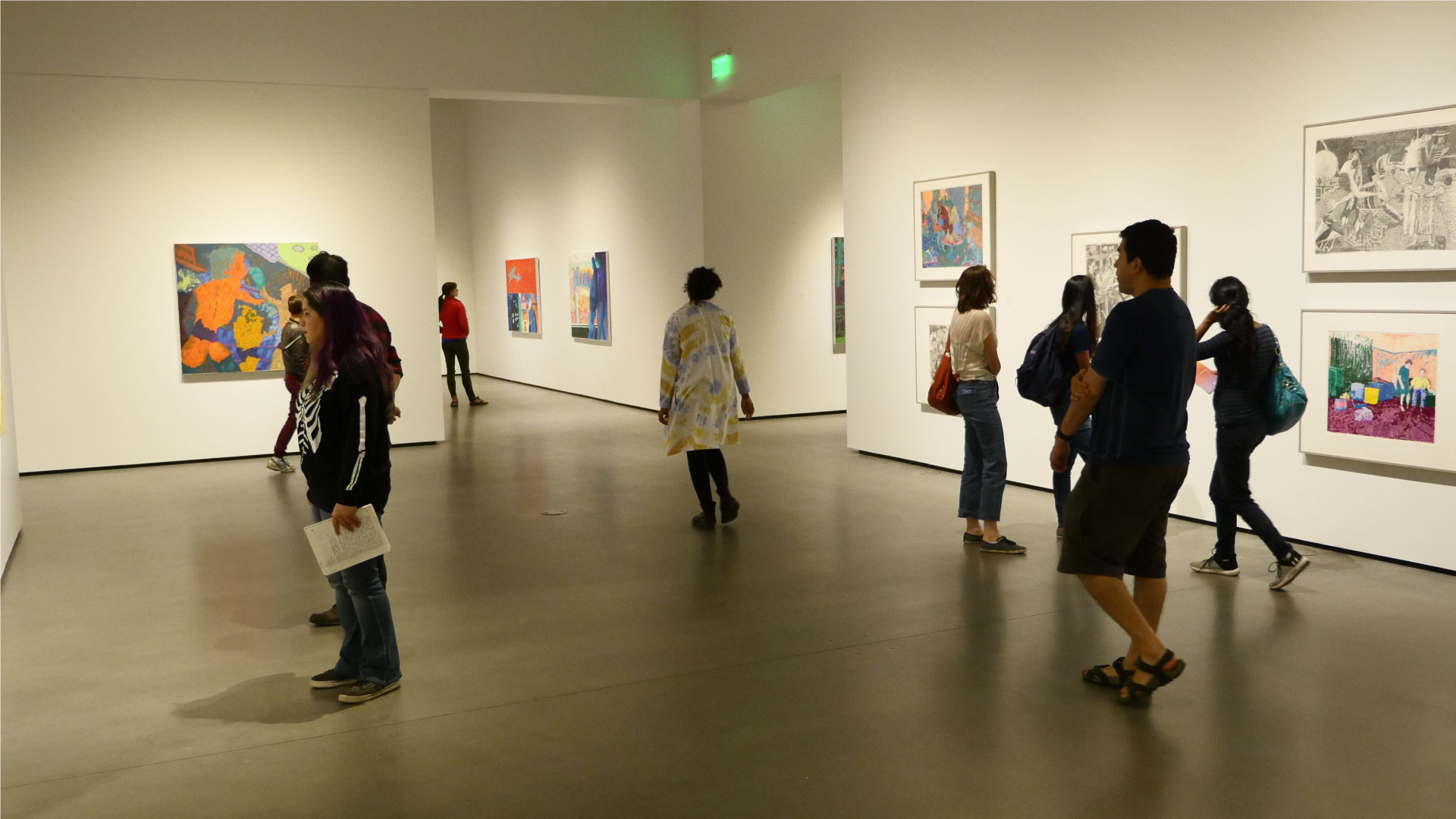 Students in the gallery viewing art.